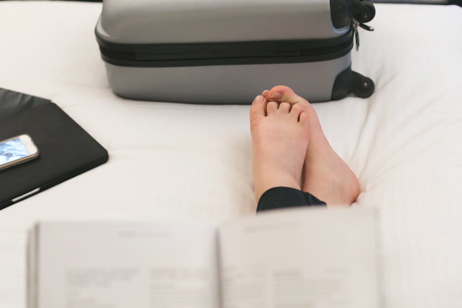 Reading On Hotel Bed